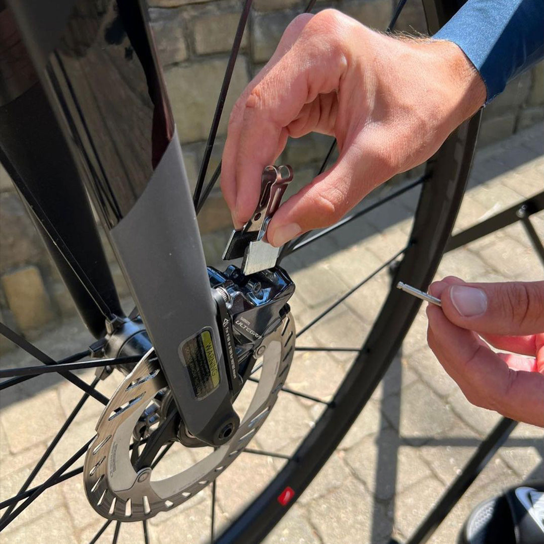 Person swapping brake pads